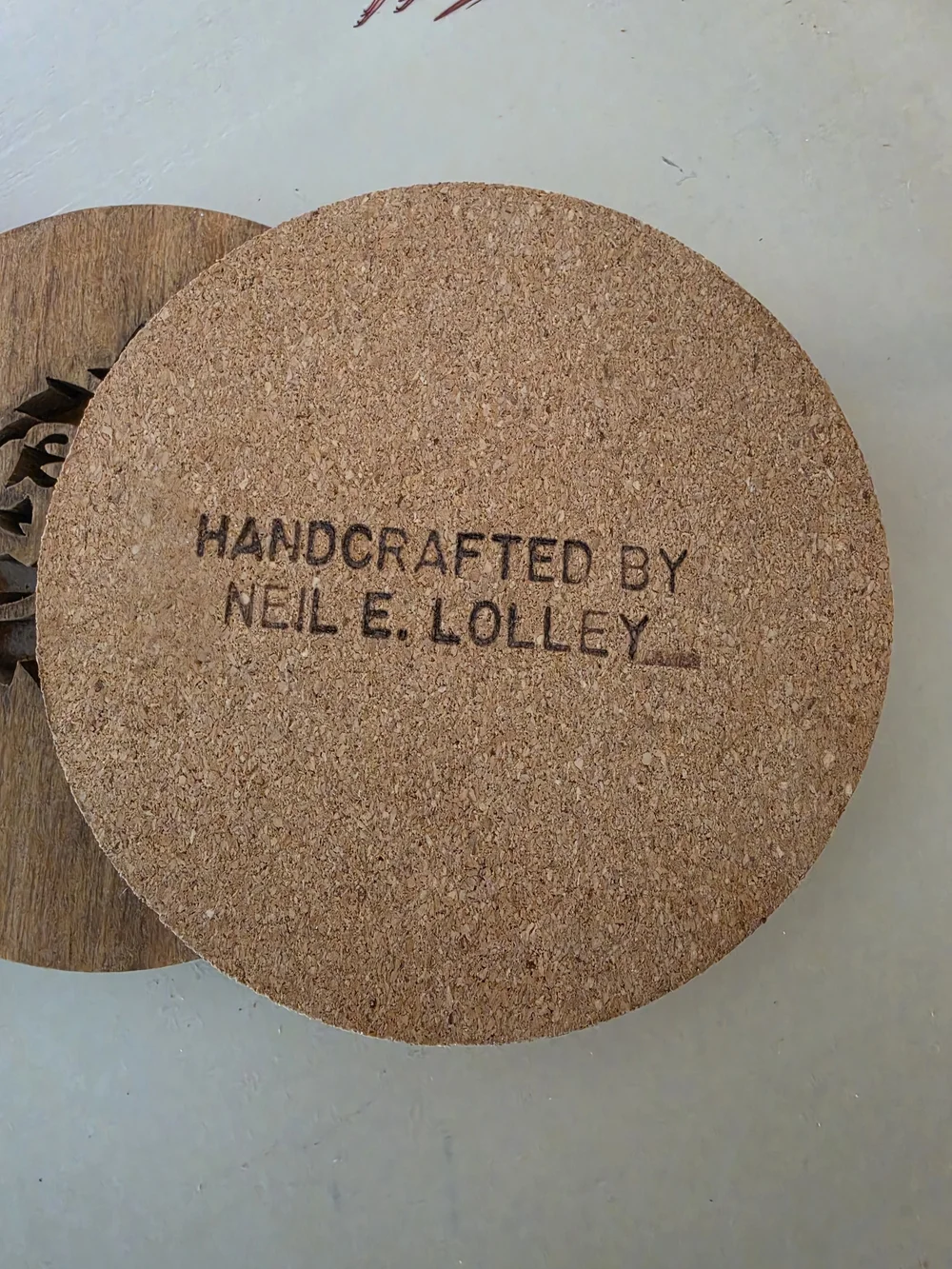 Custom carved wooden drink coaster featuring stylized Buffalo Bison silhouette